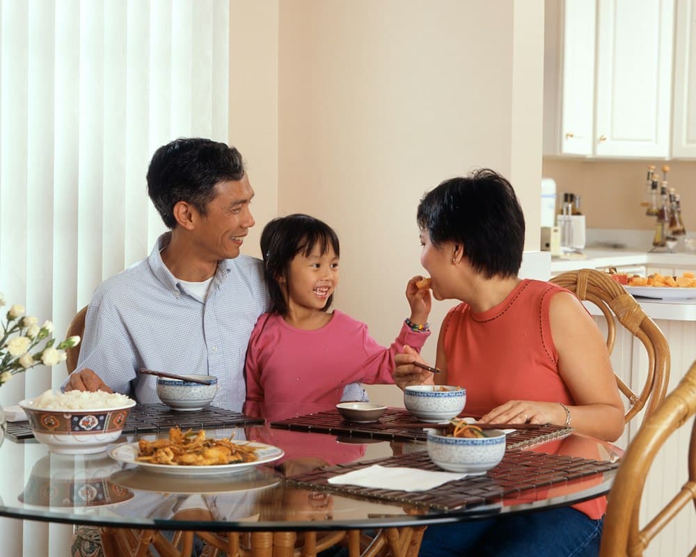 A family shares a meal together at home