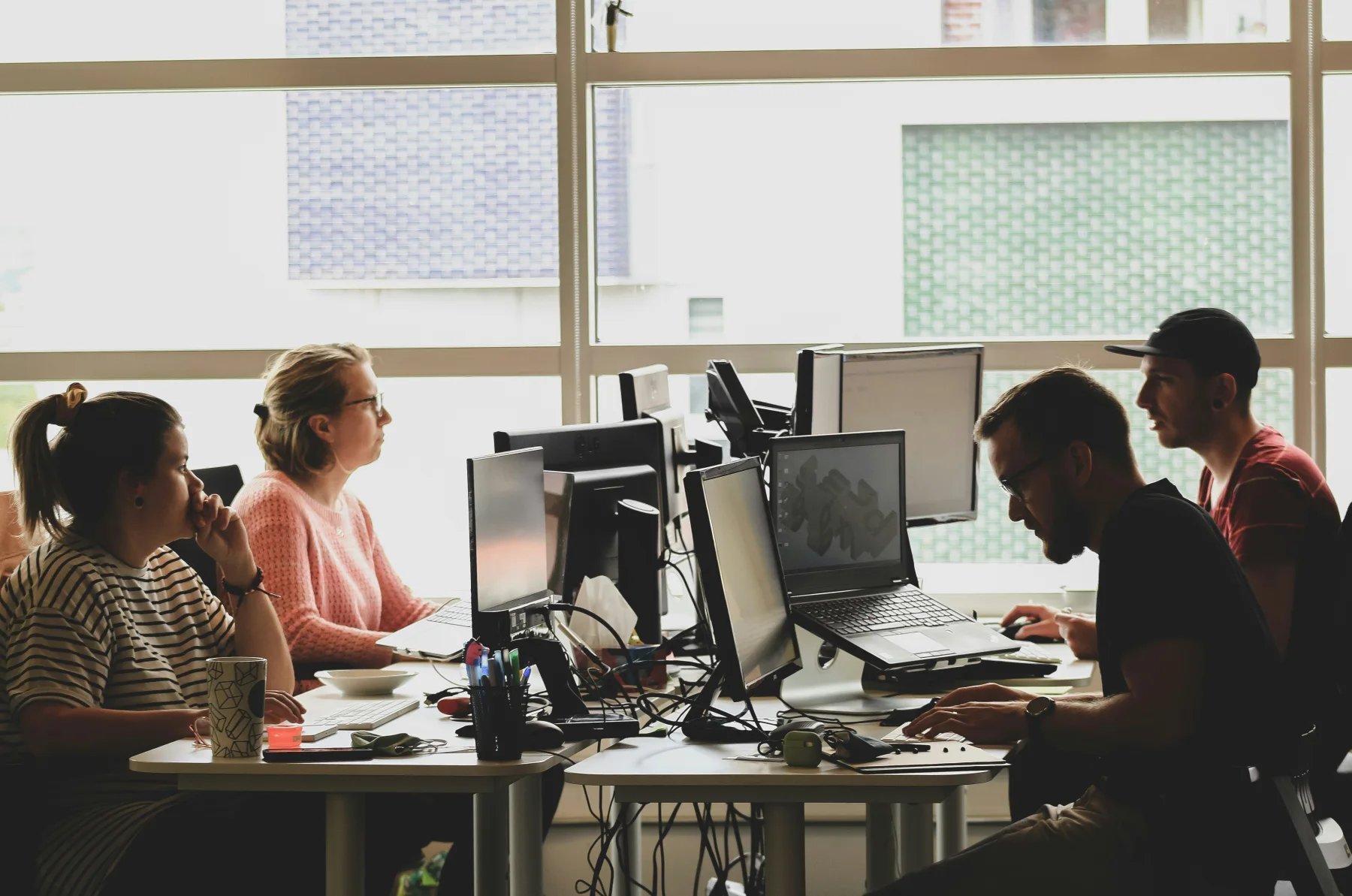 Colleagues working in a sunlit office